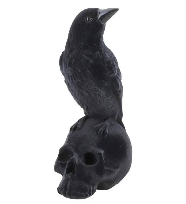 Statue corbeau sur crâne